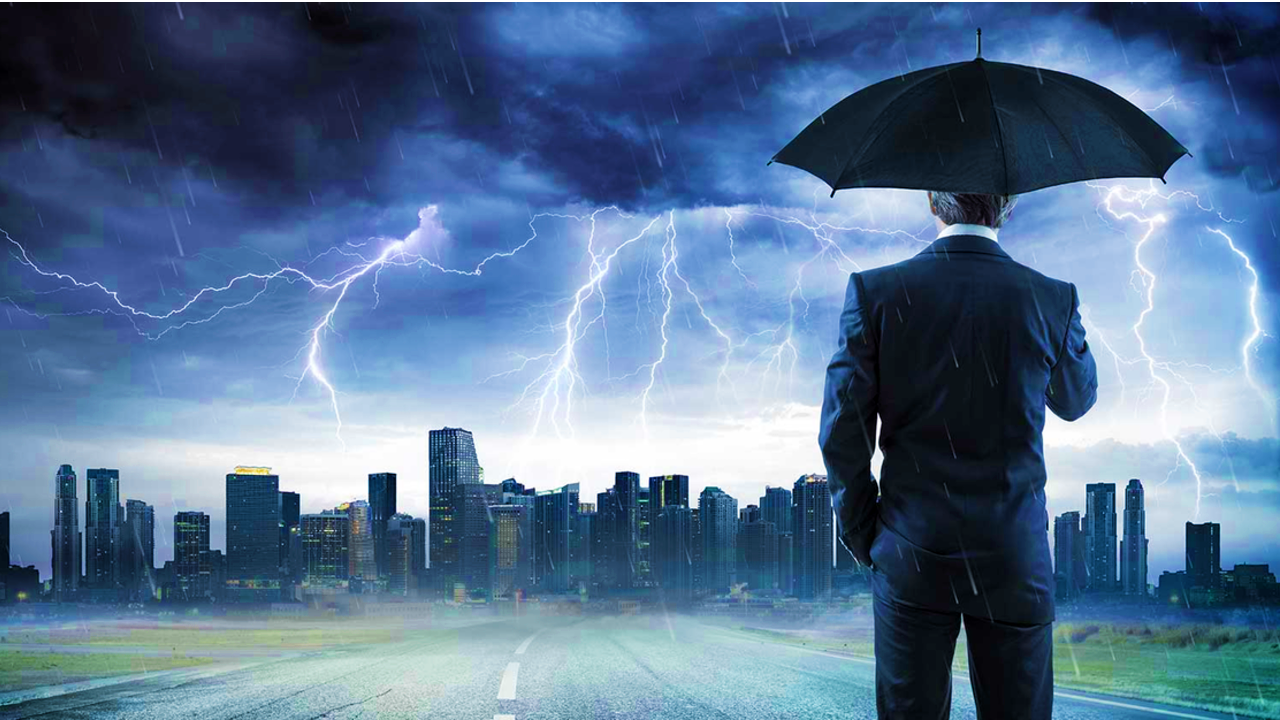 Person standing in storm over city
