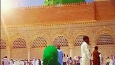 girl makes dua towards Madina Sharif