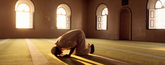 Muslim man prays in mosque