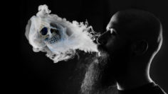 man vaping skull in smoke