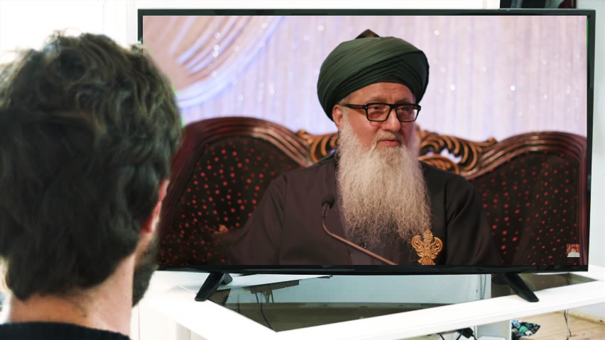 man watching Tv Shaykh Nurjan