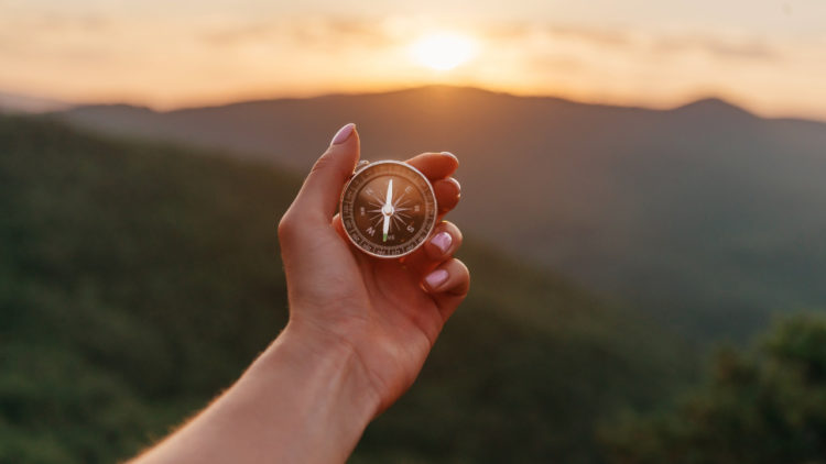 man with compass, lifes purpose