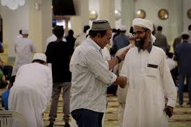 men-greet-each-other-mosque