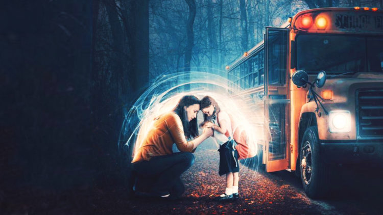 mother holding daughter protection