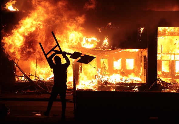 protestor lighting fires, violence, anger, fire